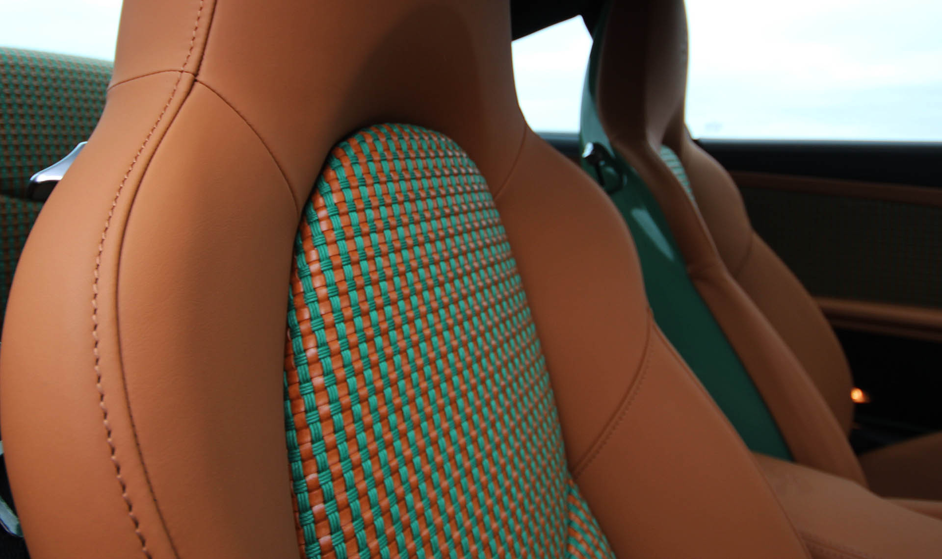 Porsche 911 997 sports classic basket weave seat centre inserts re-trim by Designls ltd highlighting basket weave material in cognac-tan and green leather